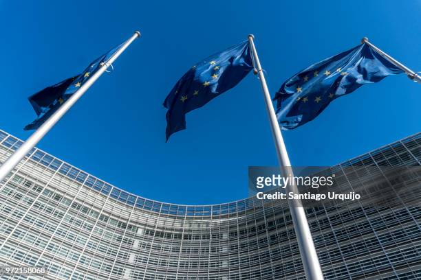 european union flags at berlaymont building of the european commission - european union symbol stock pictures, royalty-free photos & images