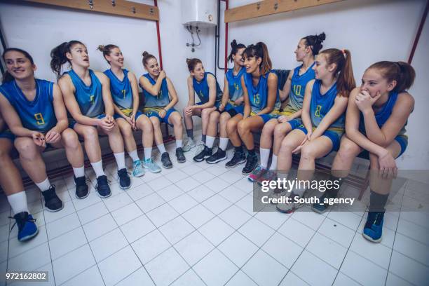 team sitting in locker room - united talent agency stock pictures, royalty-free photos & images