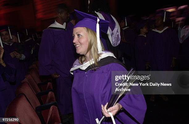 Smiling Patricia Fallone has two degrees in hand after Hunter College graduation ceremonies at Radio City Music Hall. One is hers. But another was...