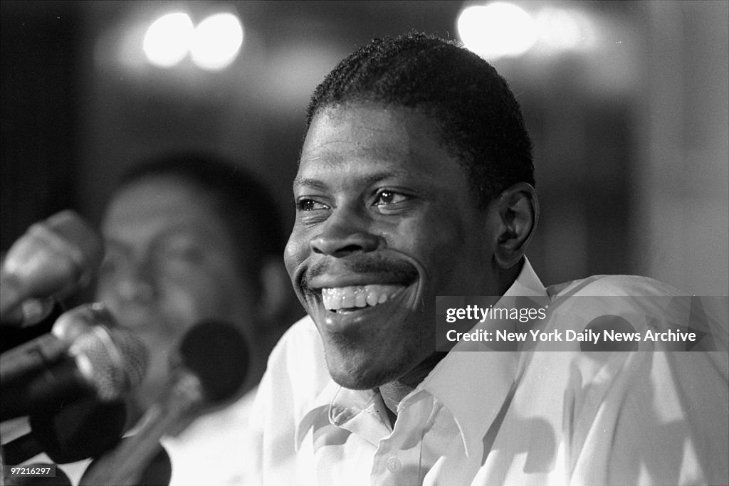 A smiling Patrick Ewing meets the press the day after the lo