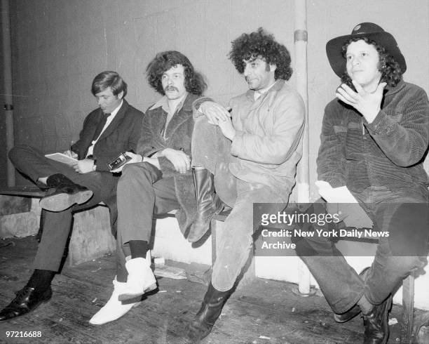 Unidentified reporter, Ed Sanders, Abbie Hoffman and Paul Krassner as they accused police of harassment.