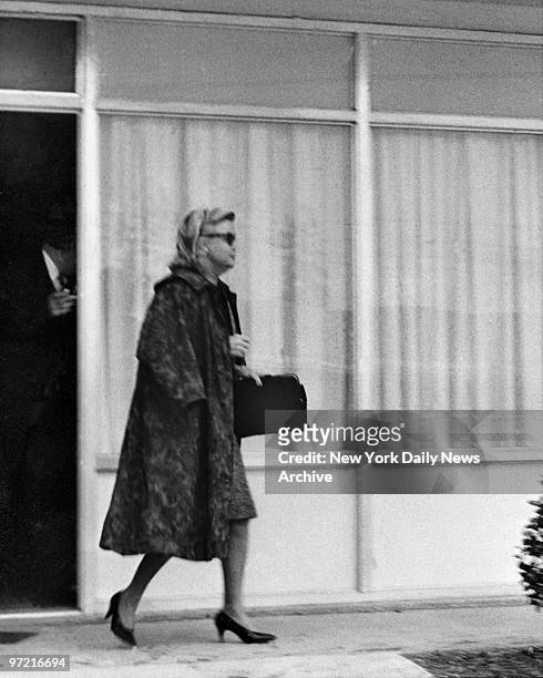 Evelyn Livermore leaving Holiday Inn Motel in Richmond Virginia.