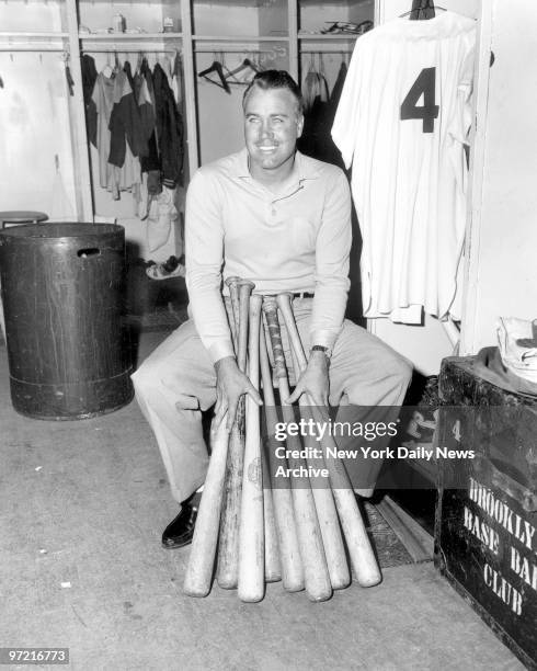 Dodgers at Ebbets Field, Before leaving for his avocado farm in California, Duke Snider yesterday caresses his lumber pile, one bat for each of his...