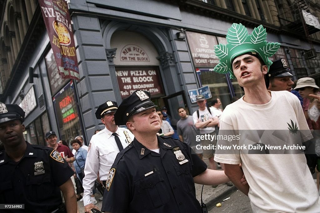 A protester is arrested during the Millennium Marijuana Marc