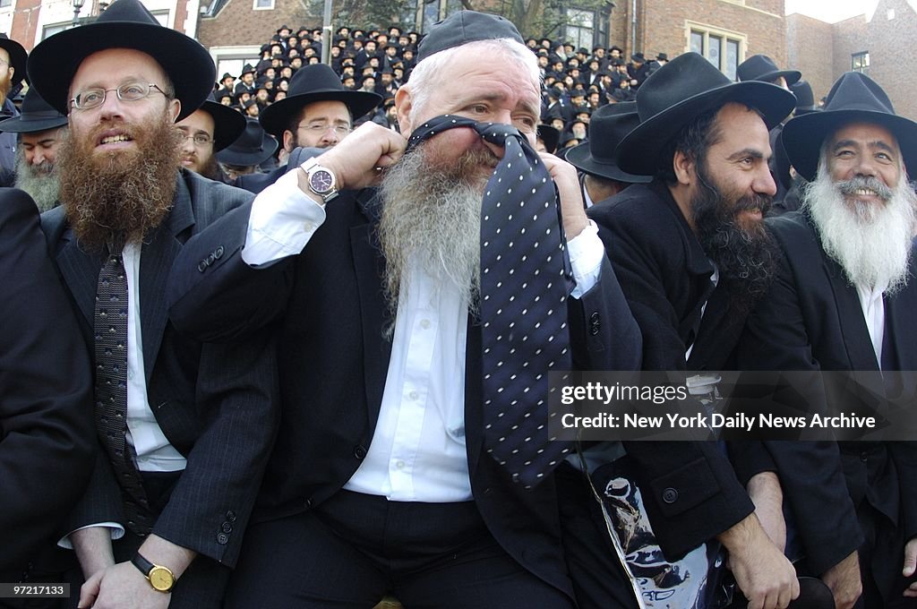 A rabbi slips on a tie as more than 2,000 rabbis from 65 cou