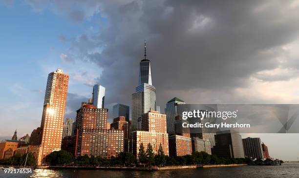 The sun reflects off the windows of buildings in Battery Park City at sunset on June 8, 2018 in New York City.