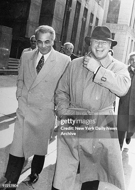 Jovial John Gotti and his attorney, Bruce Cutler, return from lunch to Manhattan Supreme Court where he is on trial on charges of conspiracy and...