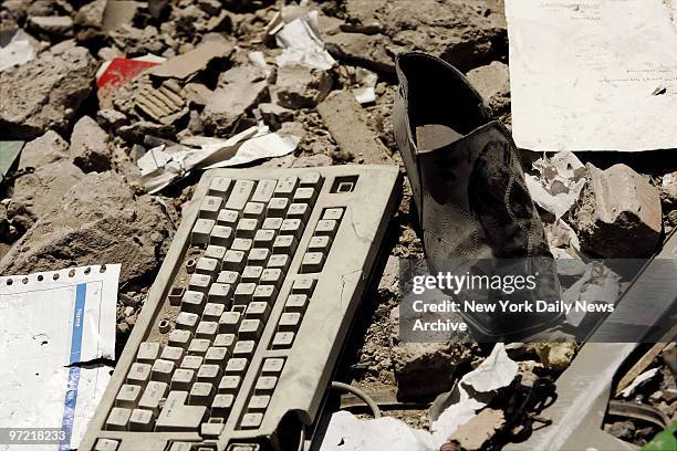 Computer keyboard and a shoe lie in the rubble in the Haret Hreik neighborhood, a Hezbollah stronghold in southern Beirut, which has been devastated...