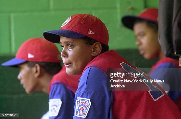 Tear trickles down the face of Rolando Paulino All-Stars' catcher Francisco Pe??a as he sits in the dugout after his team lost the U.S. Championship...