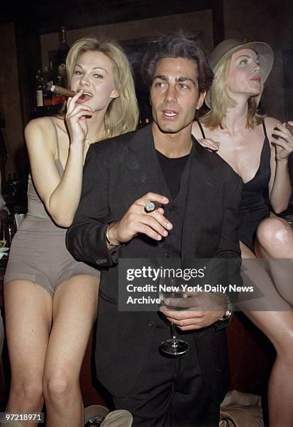 Actor Michael Bergen, of "Baywatch," and models Emily Flint and Yulia Sukhanova at Nancy Ganz's Smokin' Cigar Extravaganza at Club Macanudo.