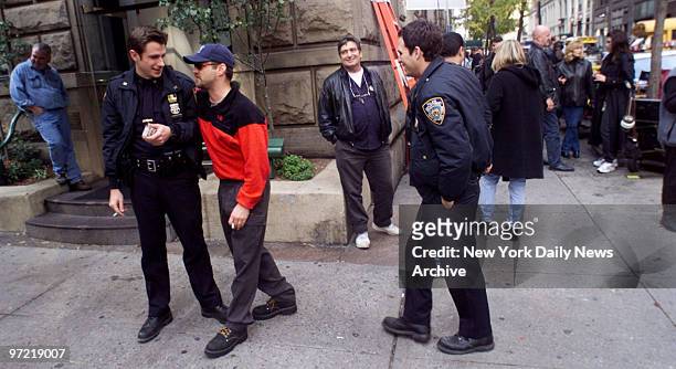 Actors Derek Cecil, Jason Priestley and Mark Ruffalo talk on the set while filming the movie "The Beat" near Gramercy Park.