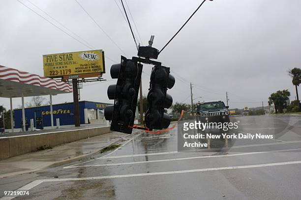 Traffic light is left dangling on Route 1A after Hurricane Frances roared through South Central Florida.