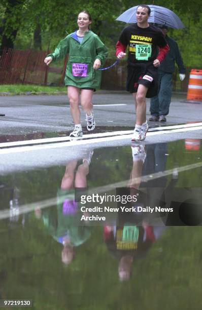 Blind runner is helped along the track during this year's annual Achilles Run in Prospect Park. Many of the runners were handicapped, some in...