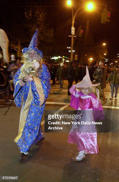 Wizard and a witch, Kristina Kop and 5-year-old daughter Mariska, cast a spell over Sixth Ave. During the annual Greenwich Village Halloween Parade.