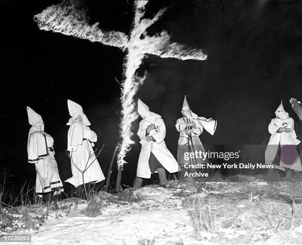 Cross is burned on Open Mountain, near Midvale, New Jersey. The cross burners were dressed like Ku Klux Klan members, but Midvale police said the...