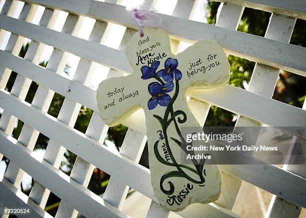 Decorative cross hangs from the gate of the Nassau mansion of the late Anna Nicole Smith the day before her funeral. She will be buried at Lakeview...