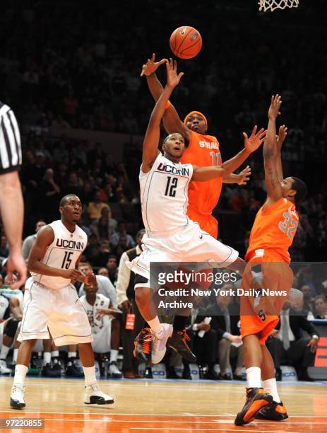 Price takes a tough shot in the 4th overtime., UCONN against Syracuse in the quarterfinal round of the 2009 Big East Championship tournament.