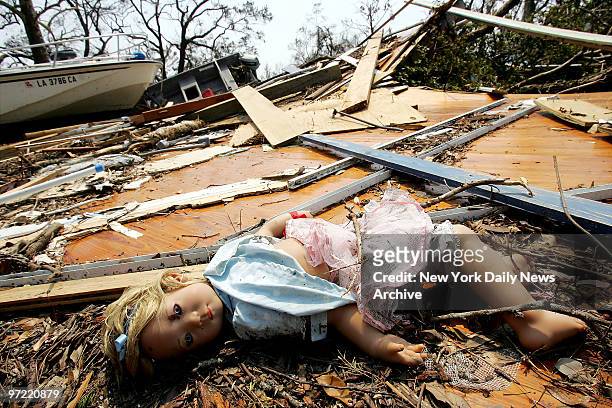Doll lies in the rubble of several homes near the beach in Waveland, Miss., in the wake of Hurricane Katrina. Whole sections of the tiny town were...