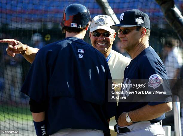 Aaron Boone, Reggie Jackson, and Manager Joe Torre during Yankee practice day before Game 3 of World Series against the Florida Marlins.