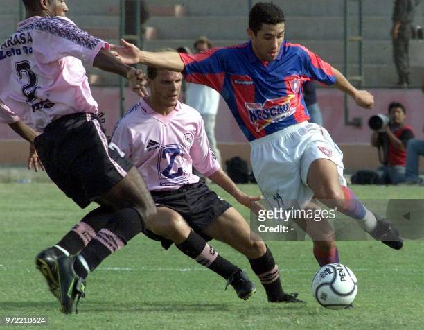 Player, Jorge Campos of Cerro Porteno of Paraguay is controling ball in front of Gabriel Silveira and Rivelino Carasas of Sport Boys in Cellao, Peru...