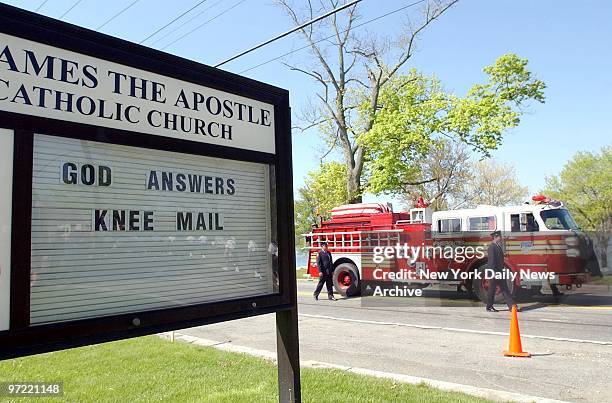 Fire engine carries the flag-covered coffin of Firefighter Daniel Harllin outside St. James the Apostle Catholc Church in Carmel, N.Y., where a...