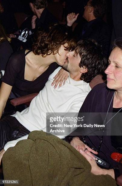 Actor Adrien Brody and girlfriend, Australian model Sky Nellor, share a smooch while sitting next to his mom, photographer Sylvia Plachy, at the...