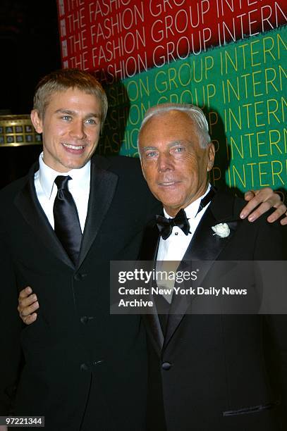 Actor Charlie Hunnam gets together with designer Giorgio Armani during the Fashion Group International's 21st annual Night of Stars awards gala at...