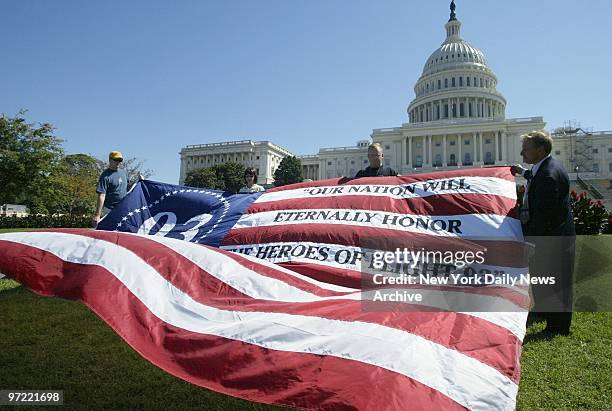 Flag memorializing the passengers aboard hijacked United Airlines Flight 93 is unfurled on the West Lawn of the Capitol. The plane crashed in a...