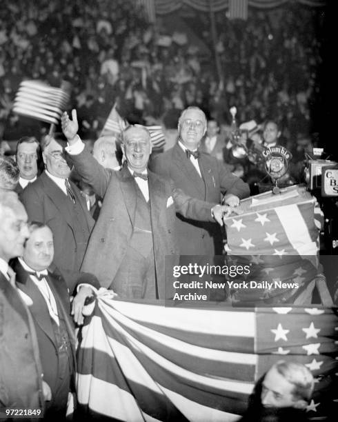 Al Smith and Franklin D. Roosevelt wave to cheering crowd at Madison Square Garden during Roosevelt's bid for the presidency.