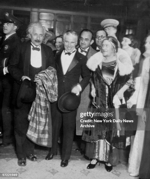 Accompanied by Prof. Albert Einstein and Elsa, Mrs. Einstein, actor-director Charles Chaplin arrives at Los Angeles theatre for premiere of new...