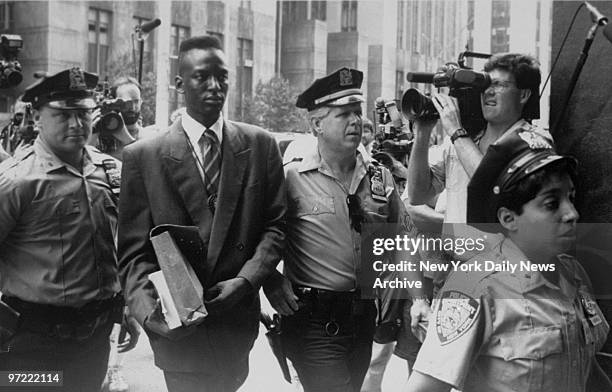 Accused rapist Yusef Salaam is escorted by police.