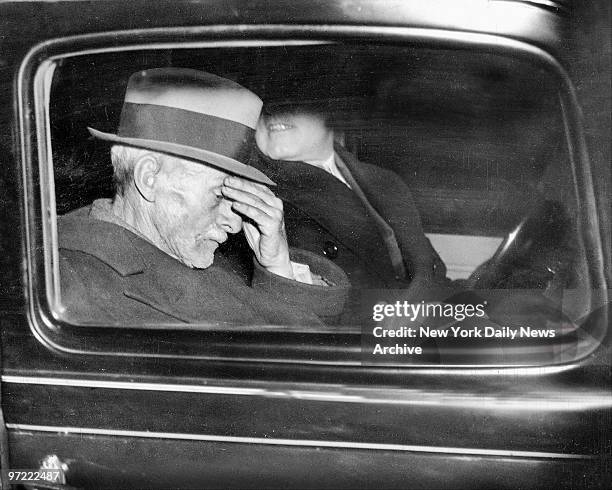 Albert Fish in car leaving Police Headquarters to guide detectives to woods at East Irvington, N.Y., where he buried child's skull.