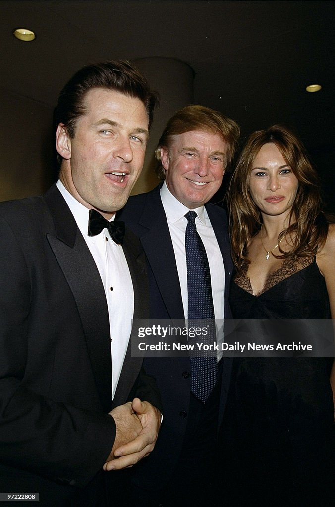 Alec Baldwin (left) is joined by Donald Trump and Melania Kn