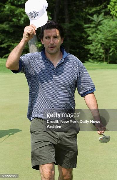 Actor Billy Baldwin offers a greeting from the fairway at the second annual Karrie Webb Celebrity Pro-Am at the Manhattan Woods Golf Club in West...