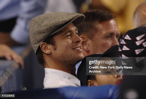 Actor Brad Pitt and Angelina Jolie's son Maddox at a New York Yankees-Seattle Mariners game at Yankee Stadium.,