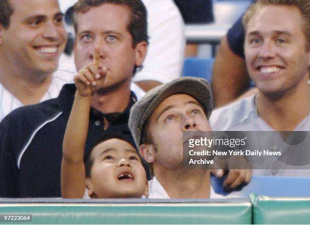 Actor Brad Pitt and son Maddox are at Yankee Stadium to catch a game between the New York Yankees and Seattle Mariners.