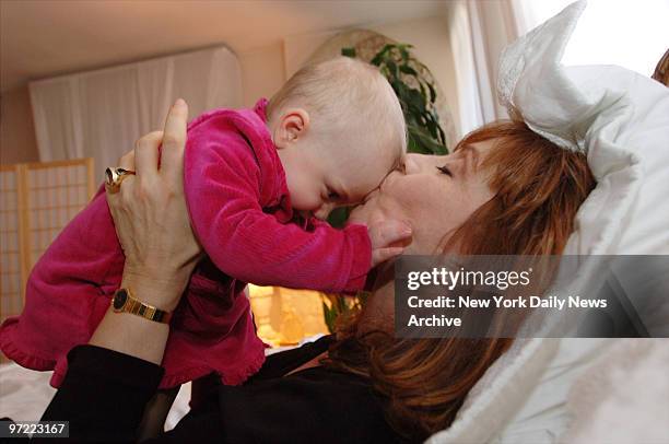 Aleta St. James, sister of Guardian Angels founder Curtis Sliwa, kisses her daughter, Francesca, in their upper West Side home. St. James turned 57 a...