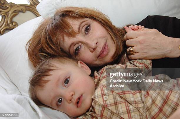 Aleta St. James, sister of Guardian Angels founder Curtis Sliwa, snuggles with her son, Gian, in their upper West Side home. St. James turned 57 a...