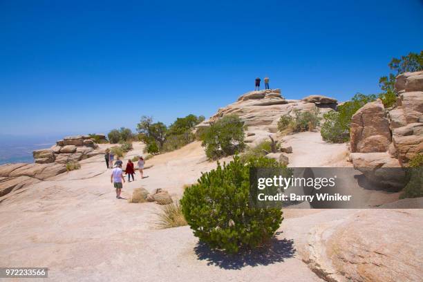 people climbing at windy point on mt. lemmon - mt lemmon fotografías e imágenes de stock