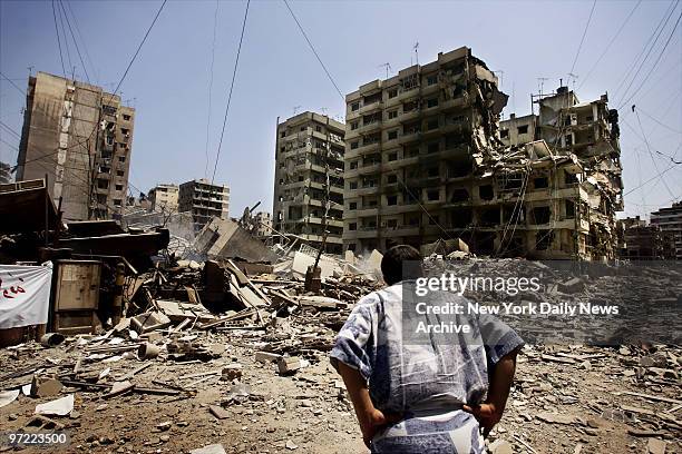 Lebanese man surveys the Haret Hreik neighborhood, a Hezbollah stronghold in southern Beirut, which has been devastated by an Israeli bombing...