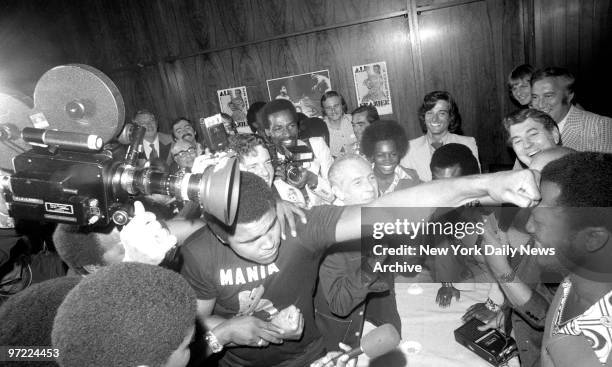 Joe Frazier and Muhammad Ali clown for spectators at Joe's press conference yesterday., Pied Piper Ali Turns Frazier Party Into Blast, By Bill...