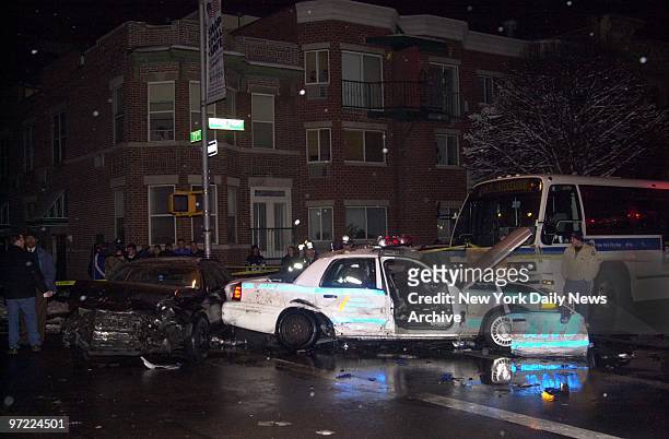 Mangled police squad car sits at the intersection of Fresh Pond Rd. And 71st Ave., in Ridgewood, after a station wagon broadsided it and sent it...