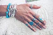 hand with lot of boho style jewerly
