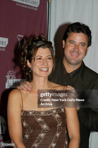 Amy Grant and husband Vince Gill are on hand at the Grand Ballroom of the Waldorf-Astoria for "42nd & Vine, Hollywood Hits Broadway." The event...