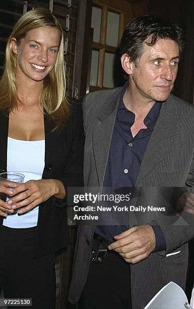 Actor Gabriel Byrne and friend, model Natasha Wenger, attend the Jill Freedman photo exhibit at Gallery 49. Byrne hosted the opening night and helped...