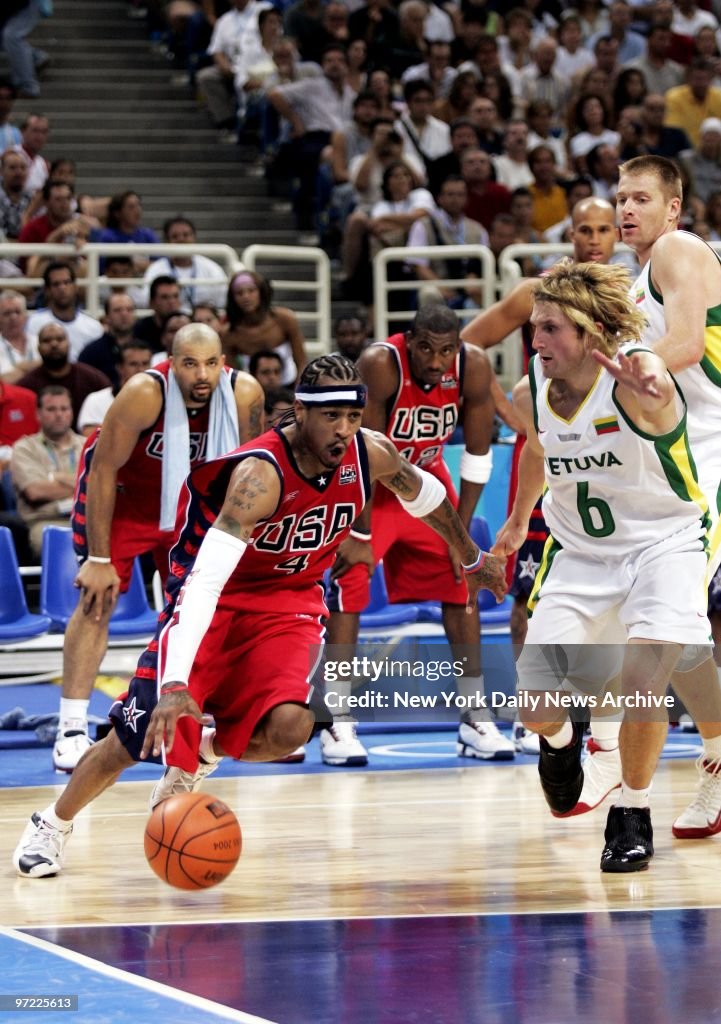 Allen Iverson of the U.S. is defended by Arvydas Macijauskas