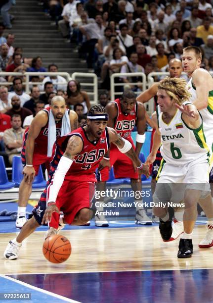 Allen Iverson of the U.S. Is defended by Arvydas Macijauskas of Lithuania during the men's basketball bronze medal match in the Olympic Indoor Hall...