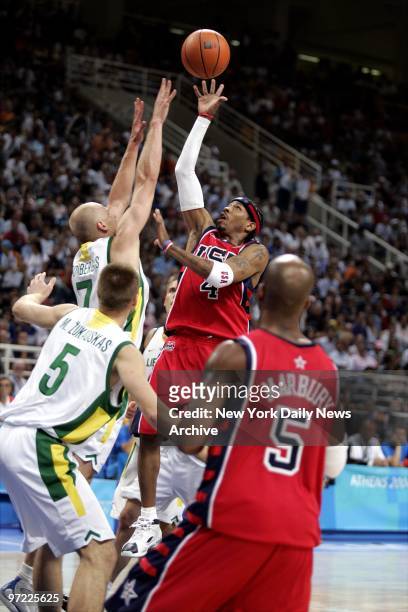 Allen Iverson of the U.S. Shoots over Lithuania's Saulius Stombergas as Mindaugas Zukauskas of Lithuania and the U.S.'s Stephon Marbury look on...