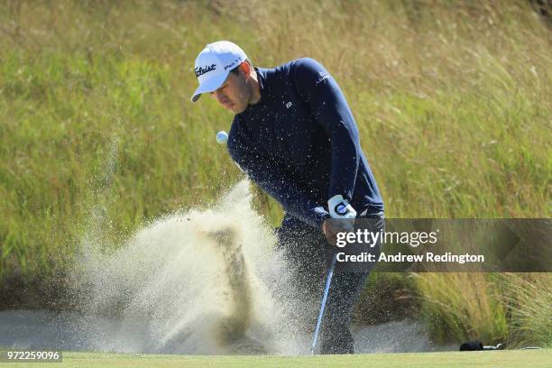 Patrick Cantlay of the United States plays a shot from a bunker on the 16th hole during a practice round prior to the 2018 U.S. Open at Shinnecock...