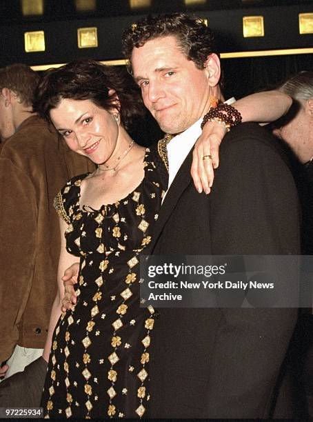 Ally Sheedy arrives with husband at New York premiere of the movie "Hideous Kinky" starring Kate Winslet.